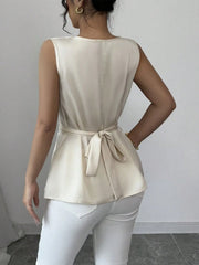 Pearlescent White Draped Neckline Peplum Hem Blouse